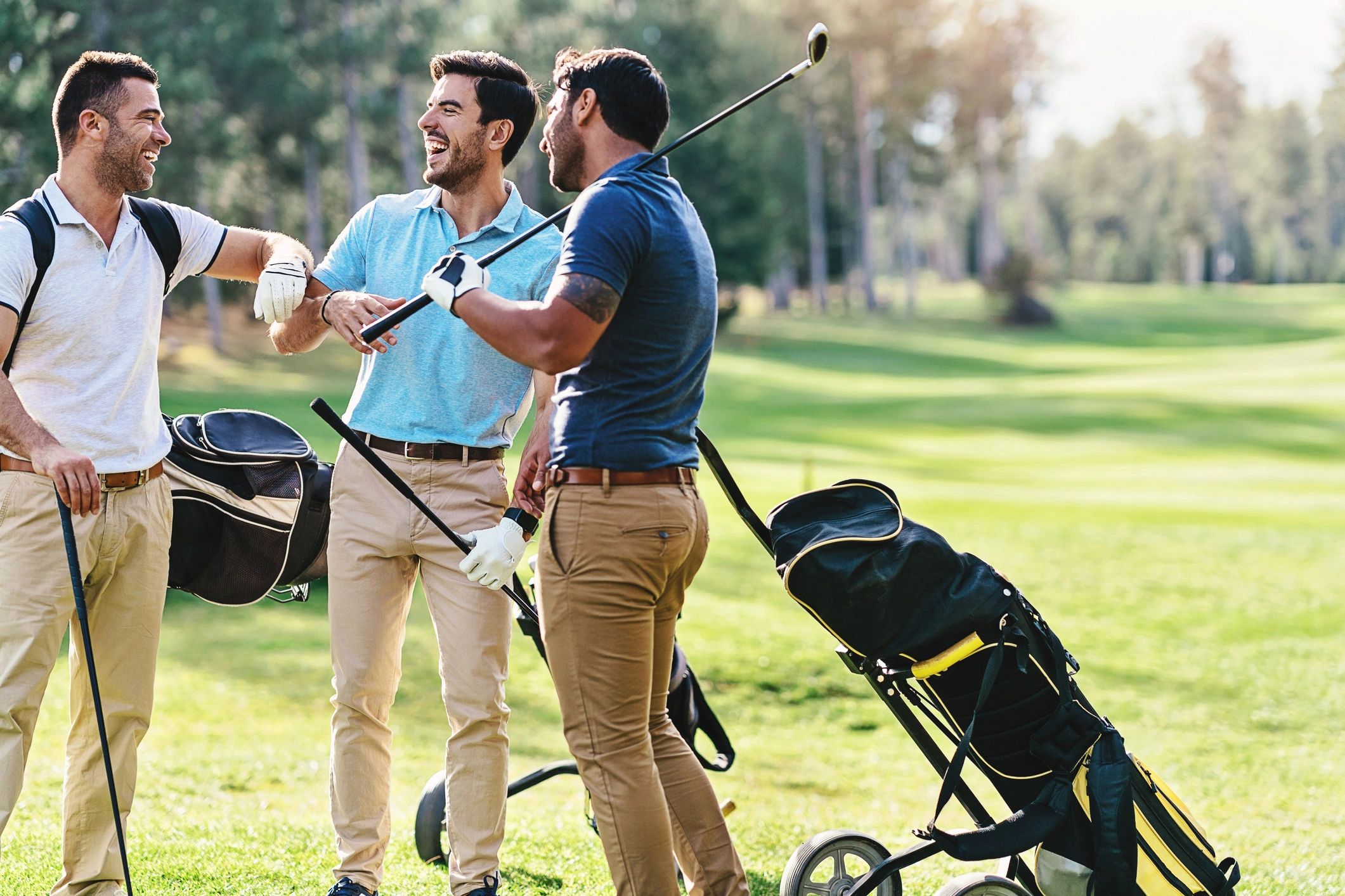 Group of golfers talking together on the course
