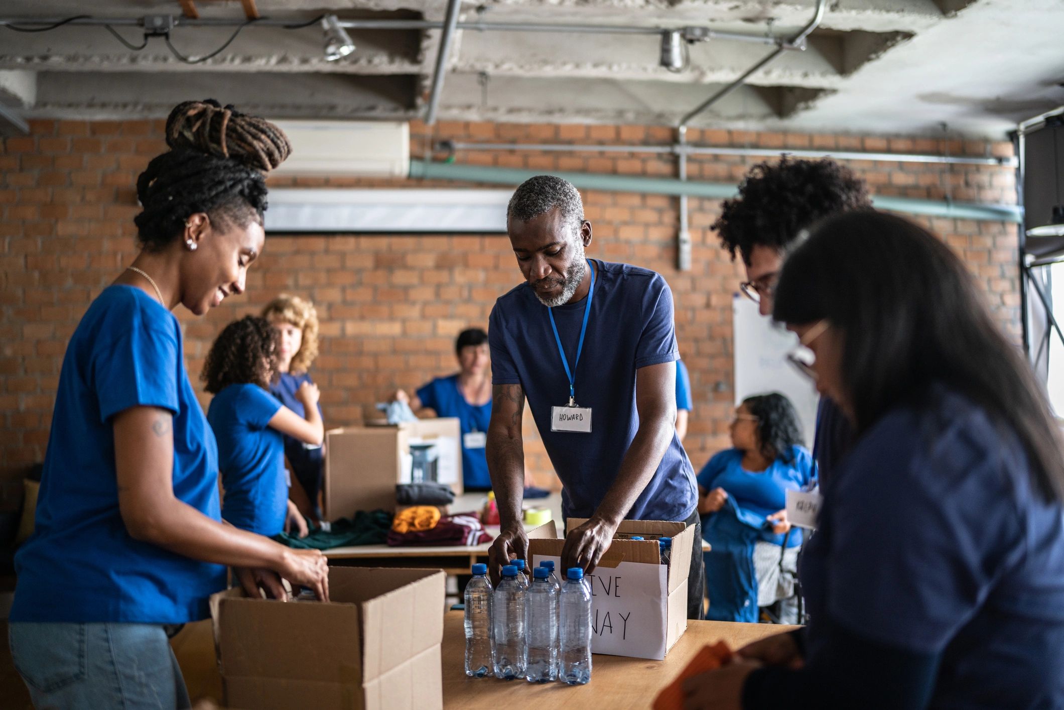 Volunteers organizing donations at a community center