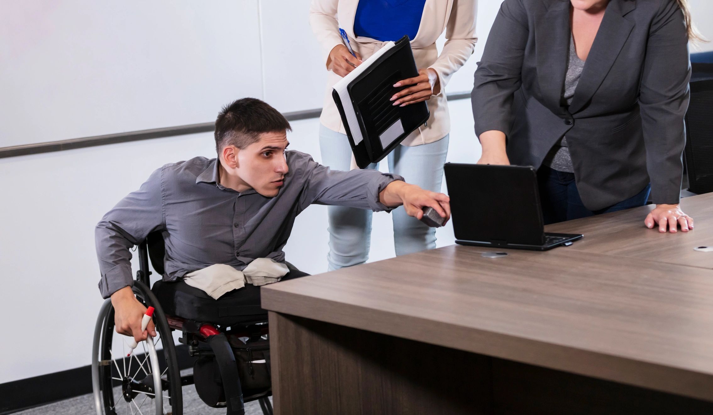 Team meeting including a colleague using a wheelchair