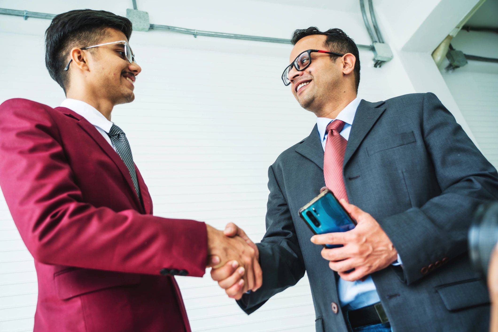 Handshake representing in-kind partnership