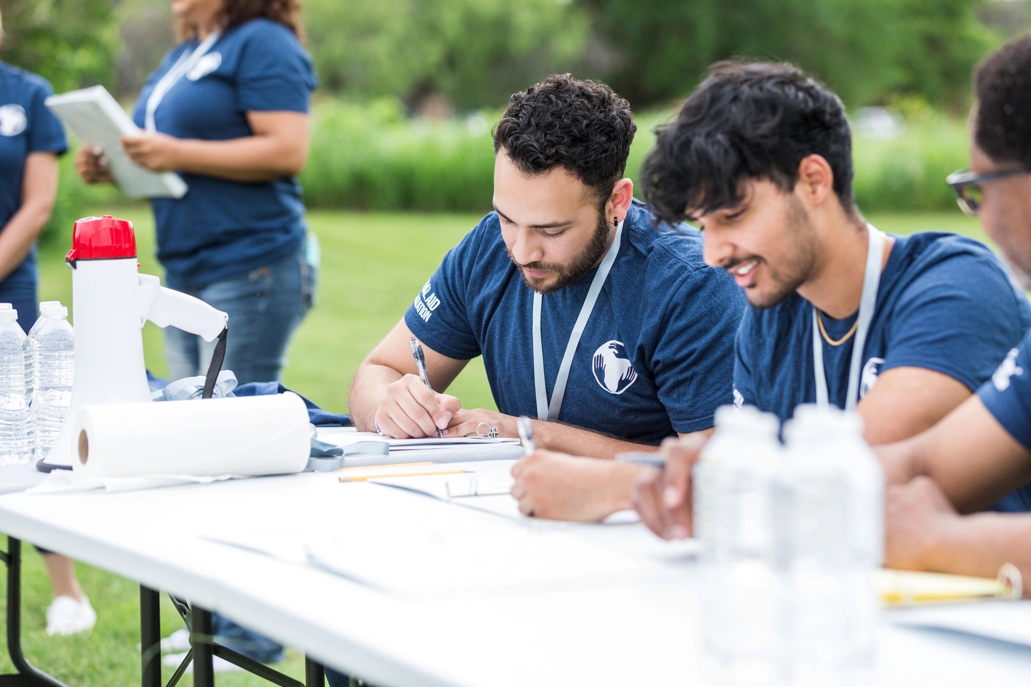 Volunteers working together at an event registration table