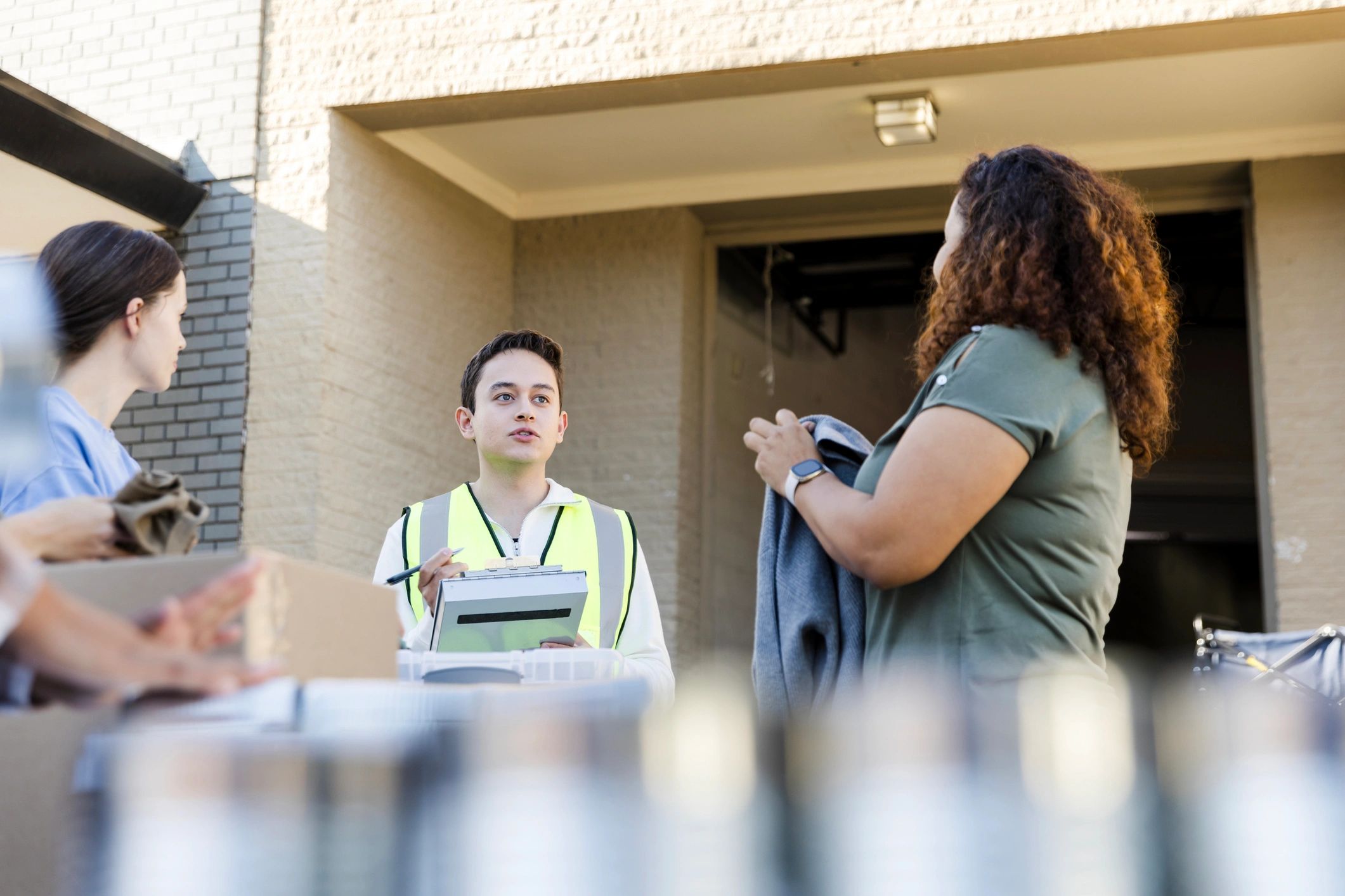 Volunteer supervisor speaking with a group