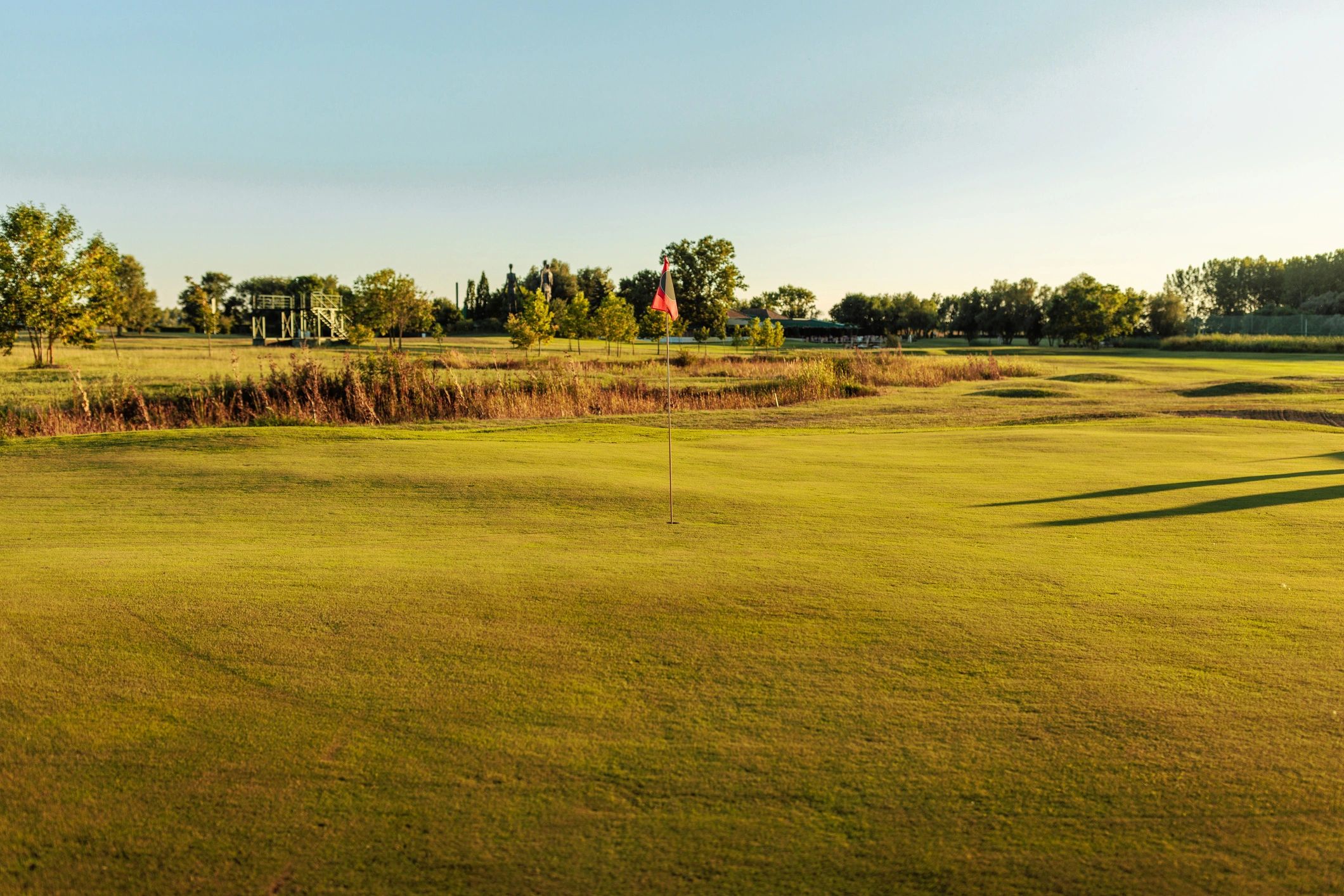 Wide shot of a golf course on a sunny day