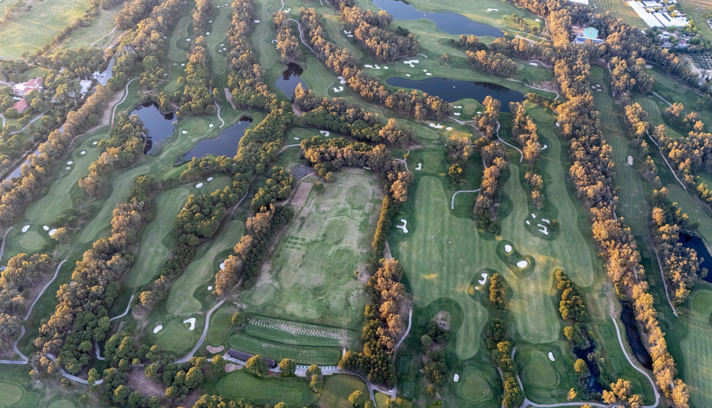Drone view of golf course with ponds