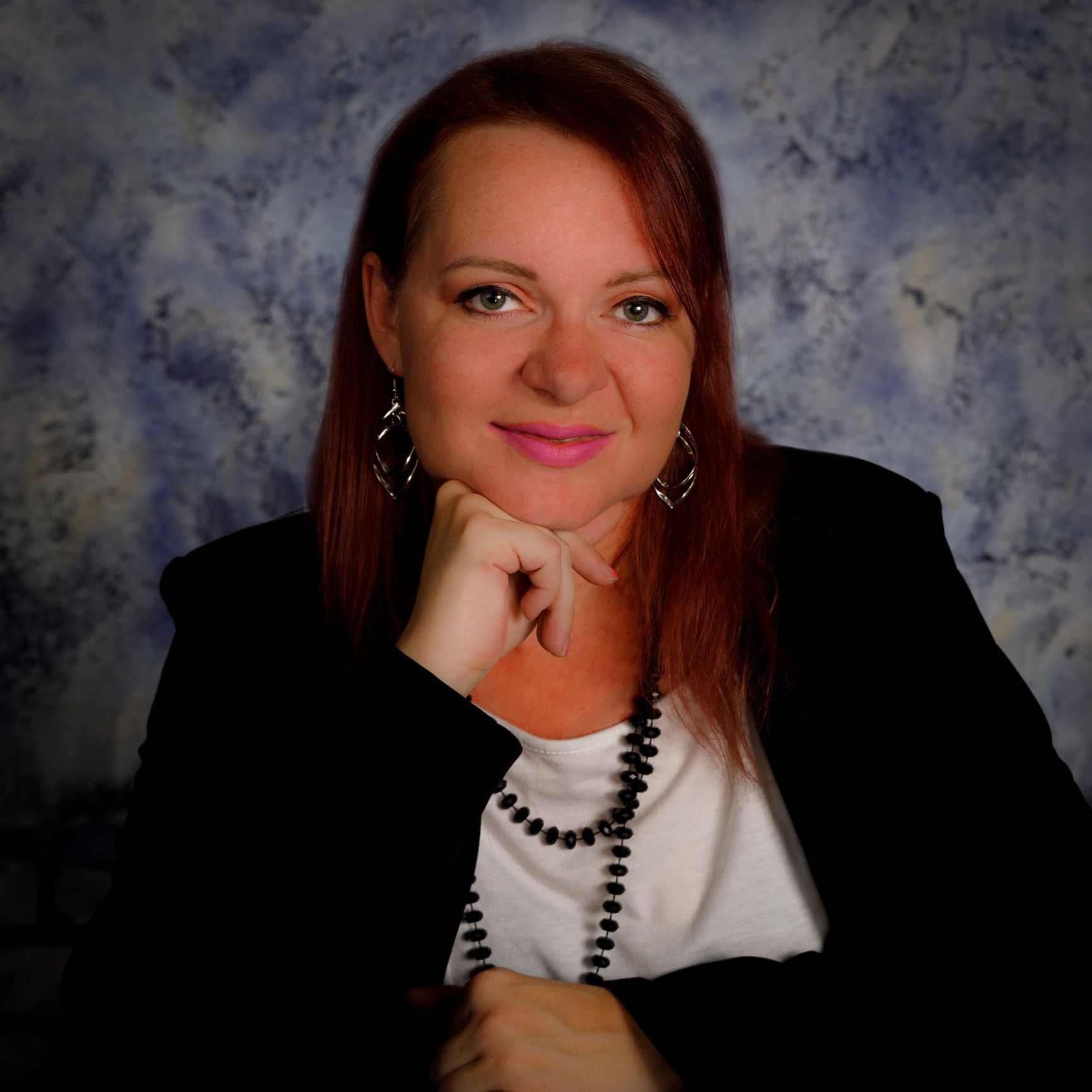 Professional headshot of a smiling woman