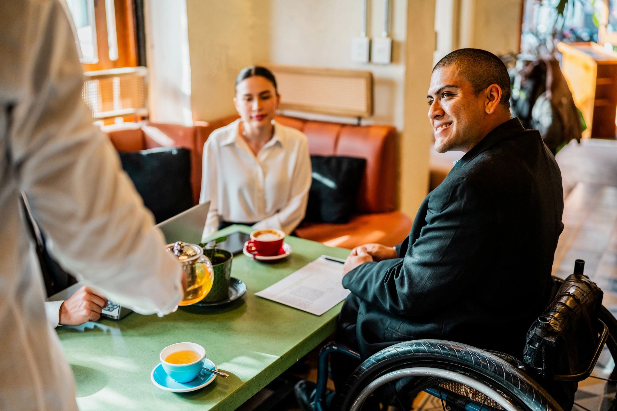 Inclusive workplace conversation at a coffee shop