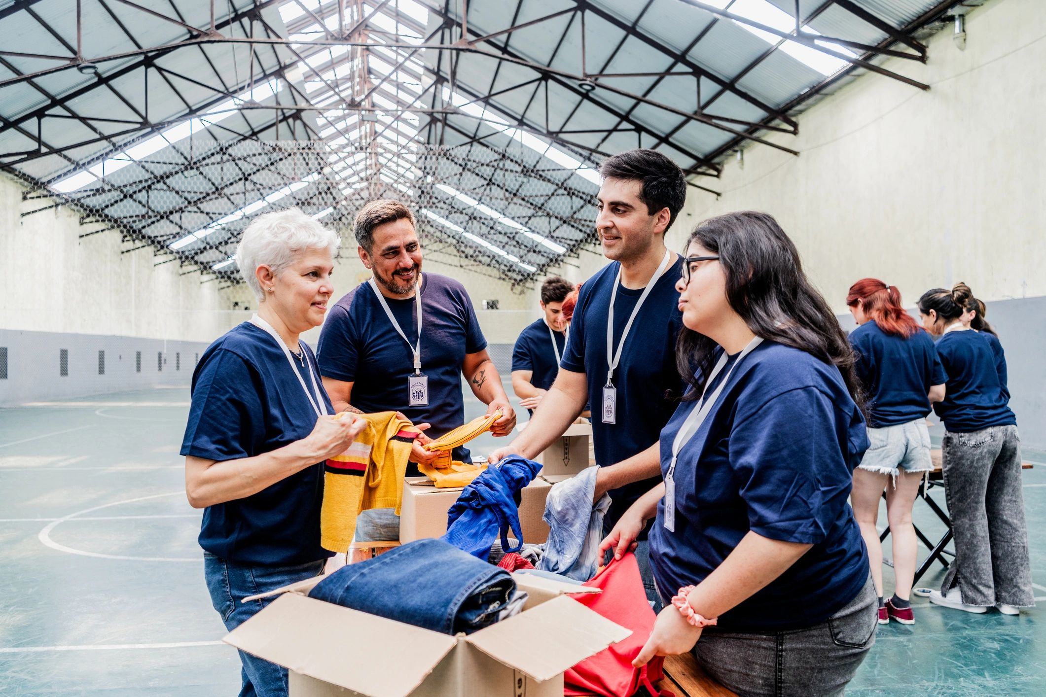 Volunteers organizing donation boxes at a community center